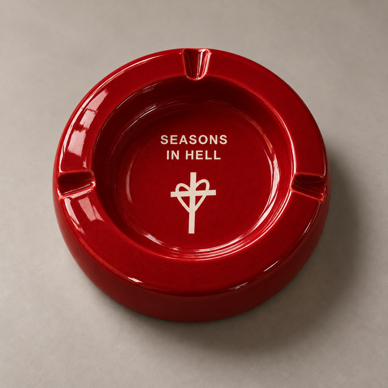 Red Ceramic Ashtray with Seasons In Hell lettering and heart and cross