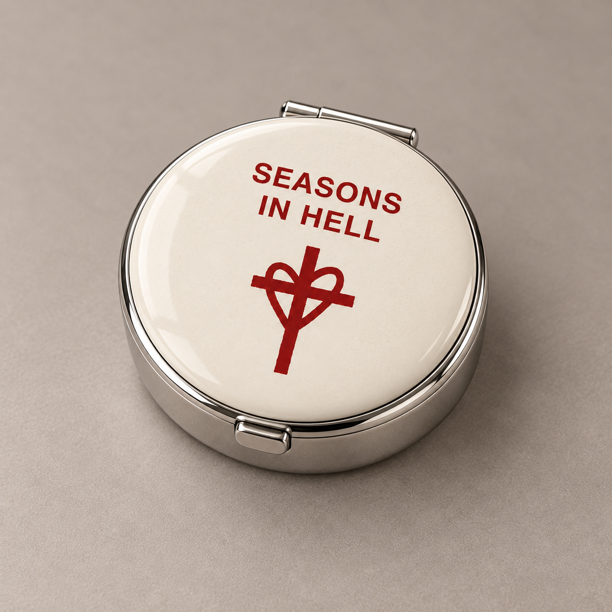 White circular portable ashtray with heart and cross